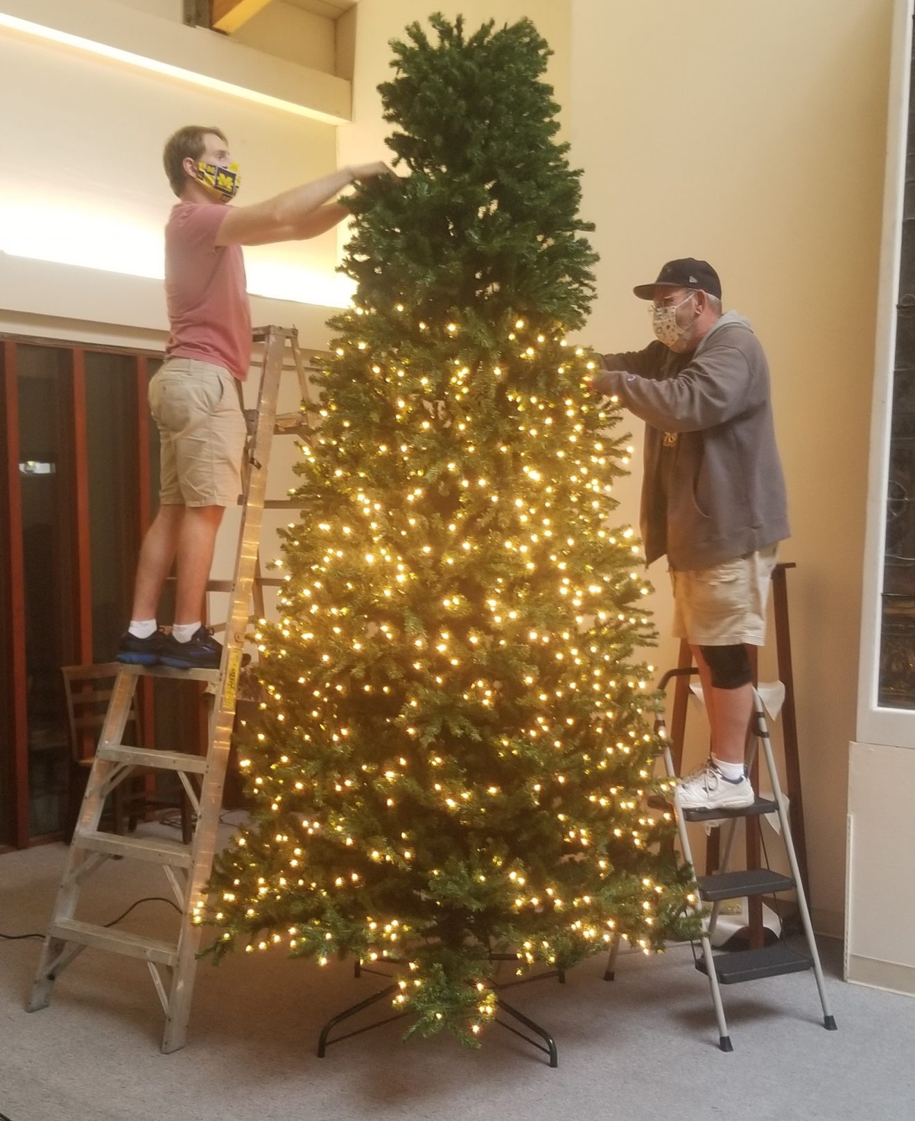 SJMC men help decorate our church for Christmas